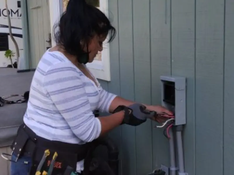 Licensed electrician wiring an exterior subpanel in Vidalia