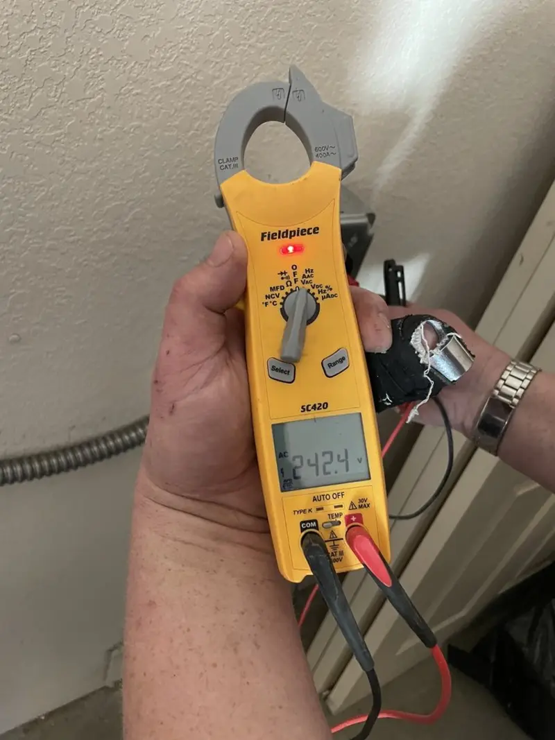 Voltage testing with clamp meter during Whole House Surge Protector in Vidalia